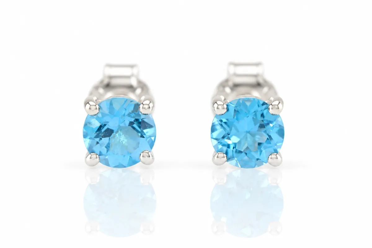 Srebrne kolczyki z naturalnym niebieskim topazem "Swiss Blue"
