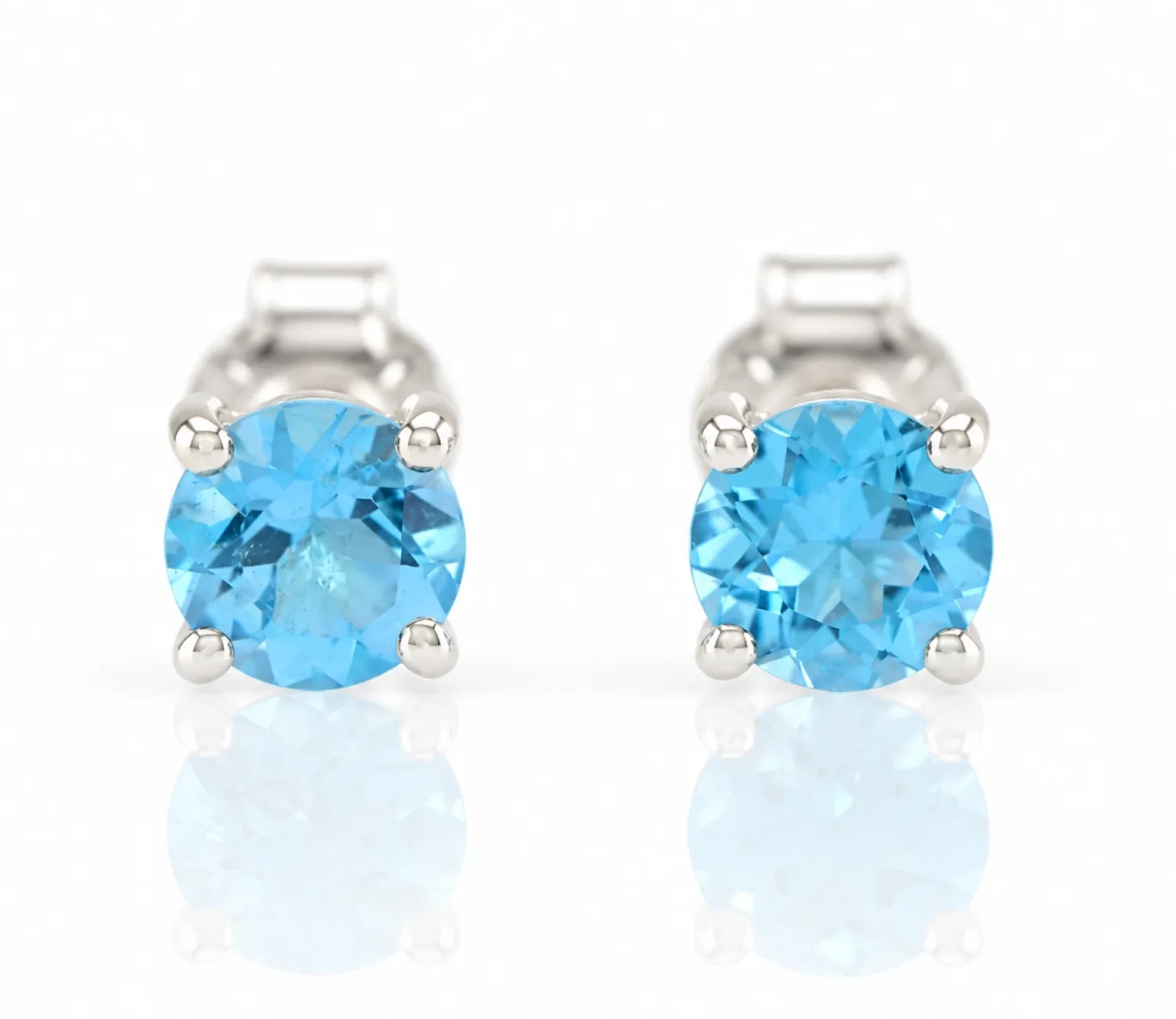 Srebrne kolczyki z naturalnym niebieskim topazem "Swiss Blue"